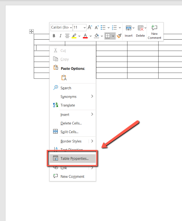 Screenshot of a Word Document with a red arrow pointing toward the "Table Properties" tool. 