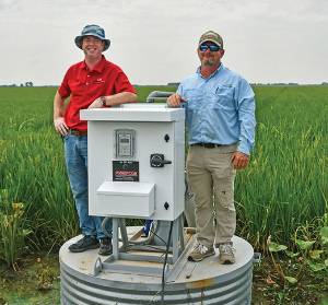 Research team on top of equipment