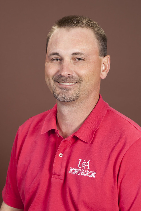 Portrait of Chad Norton with a red polo shirt